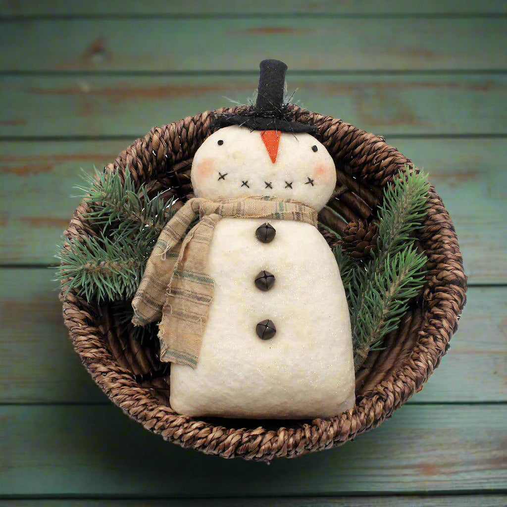 Primitive snowman bowl filler in a basket