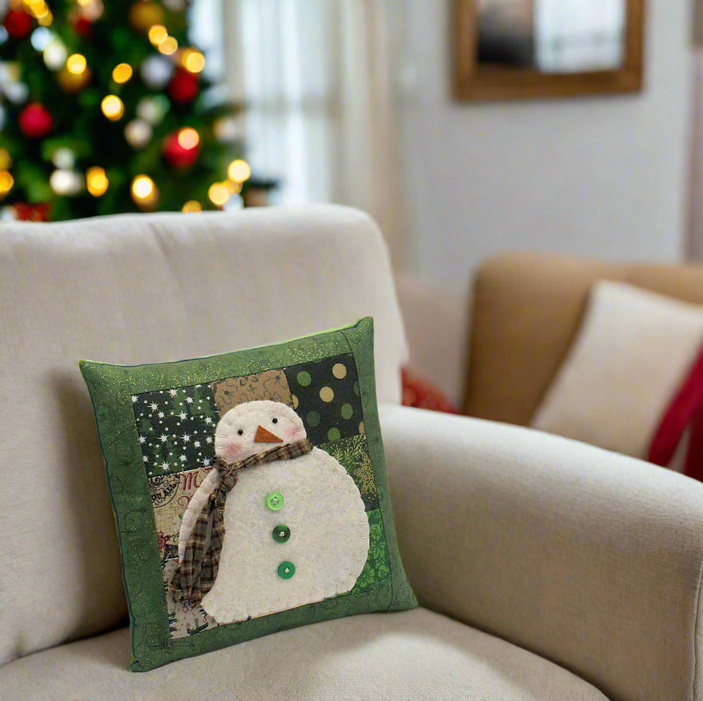 Decorative pillow with a snowman design