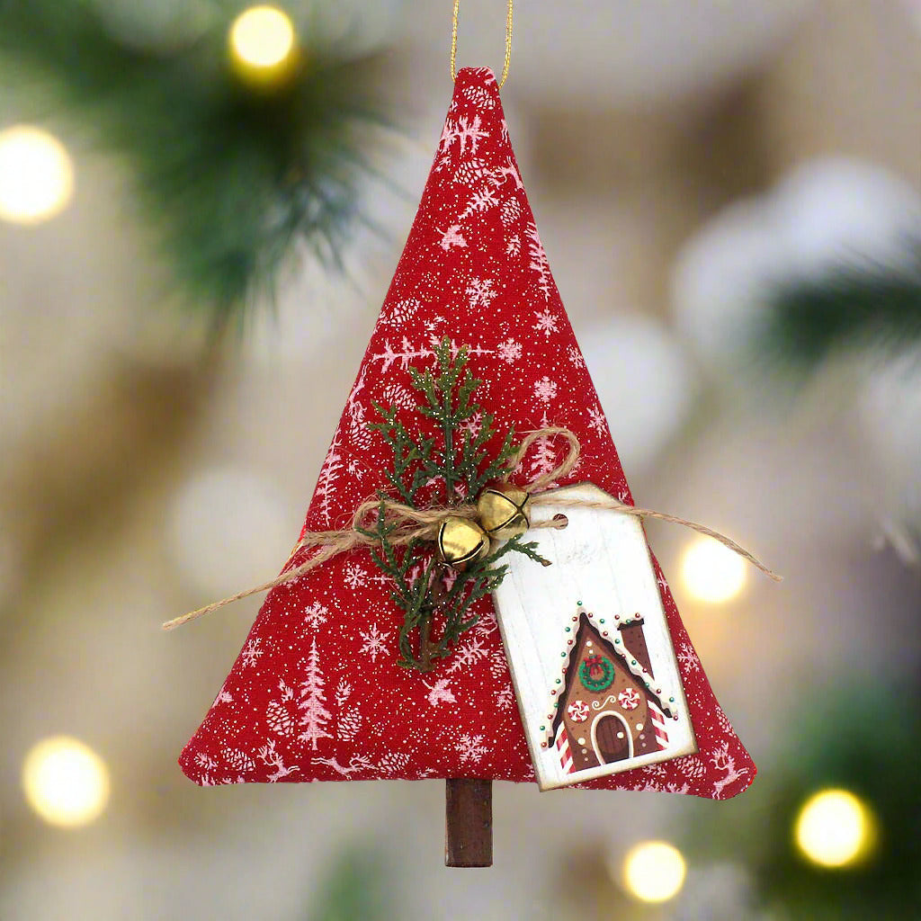Red fabric Christmas tree ornament with greenery and a tag