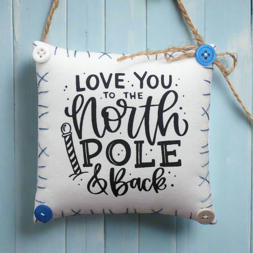 Fabric mini pillow sign with 'Love you to the North Pole & Back' text