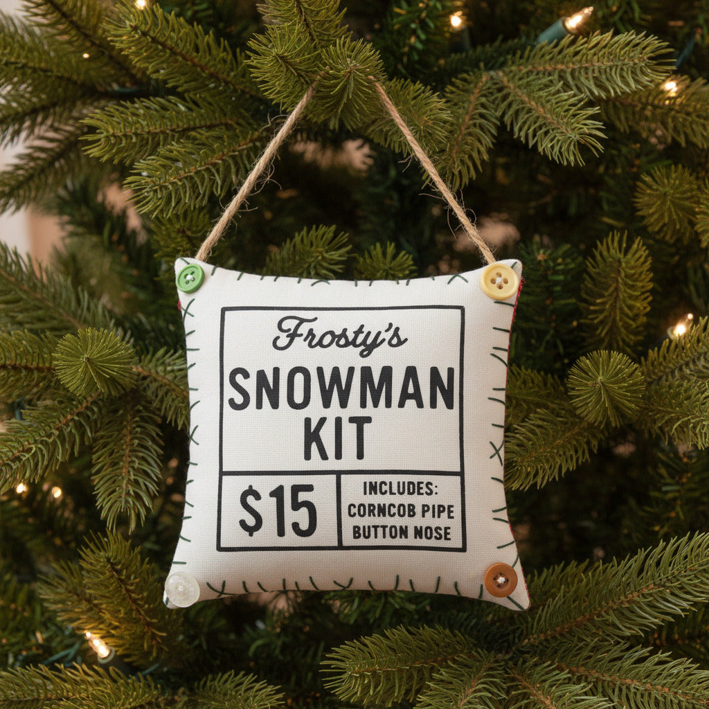 Fabric pillow sign with 'Frosty's Snowman Kit' text