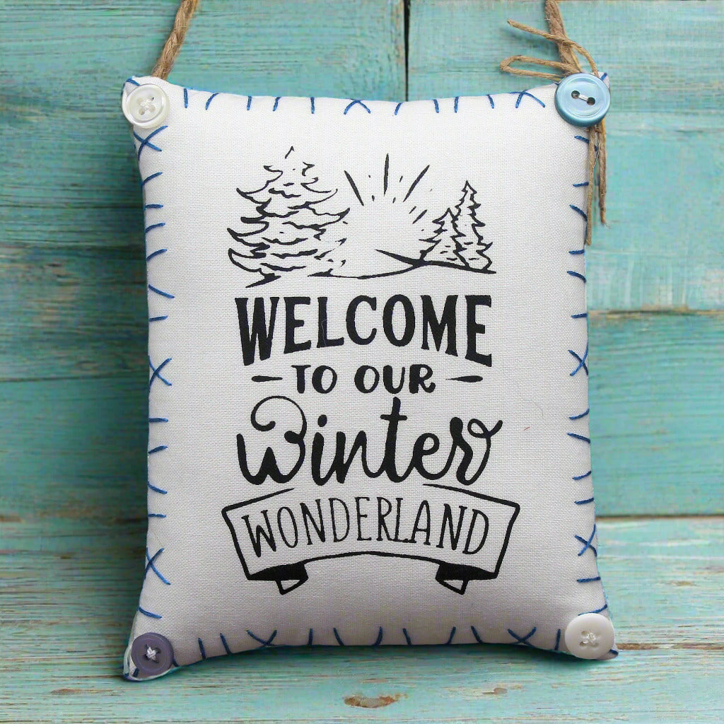 Fabric sign with 'Welcome to our winter wonderland' text