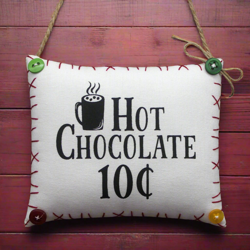 Decorative fabric sign with 'Hot Chocolate 10c' text and mug icon