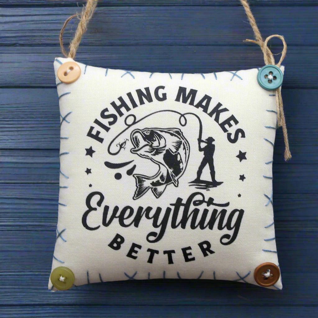 Hanging mini pillow with 'Fishing Makes Everything Better' text and graphics