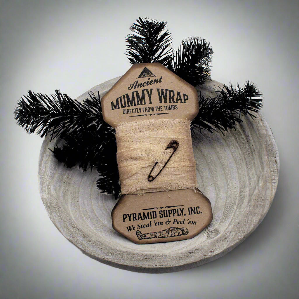 Mummy wrap with decorative elements on a white background