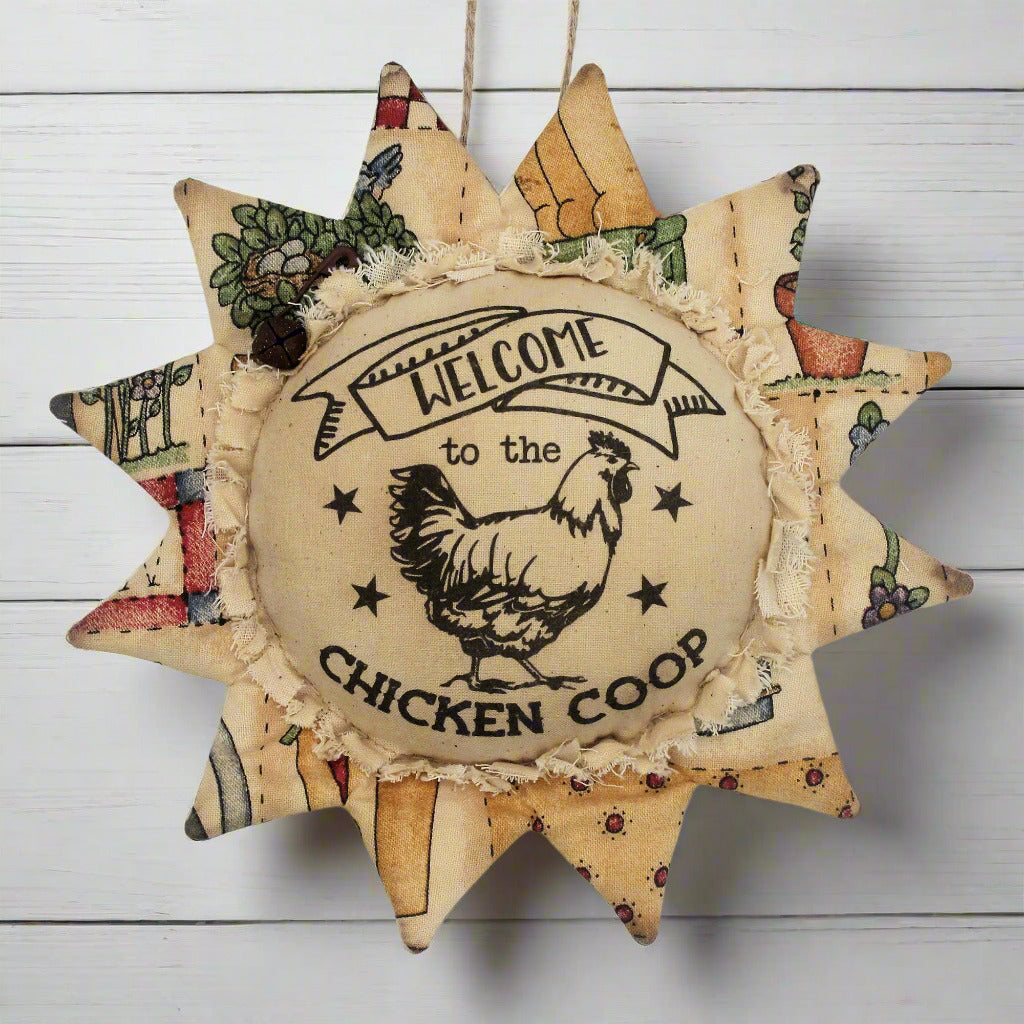 Primitive fabric sunflower ornament that reads 'welcome to the chicken coop'