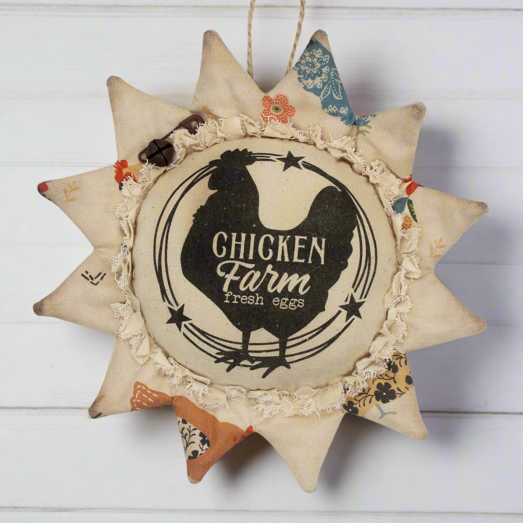 Primitive fabric sunflower ornament with an advertisement for a chicken farm