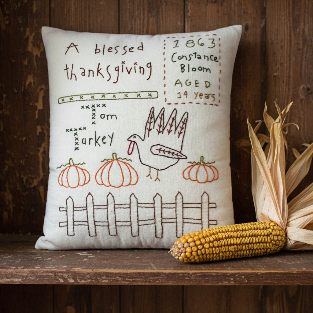 Decorative hand-stitched pillow with a Thanksgiving turkey design