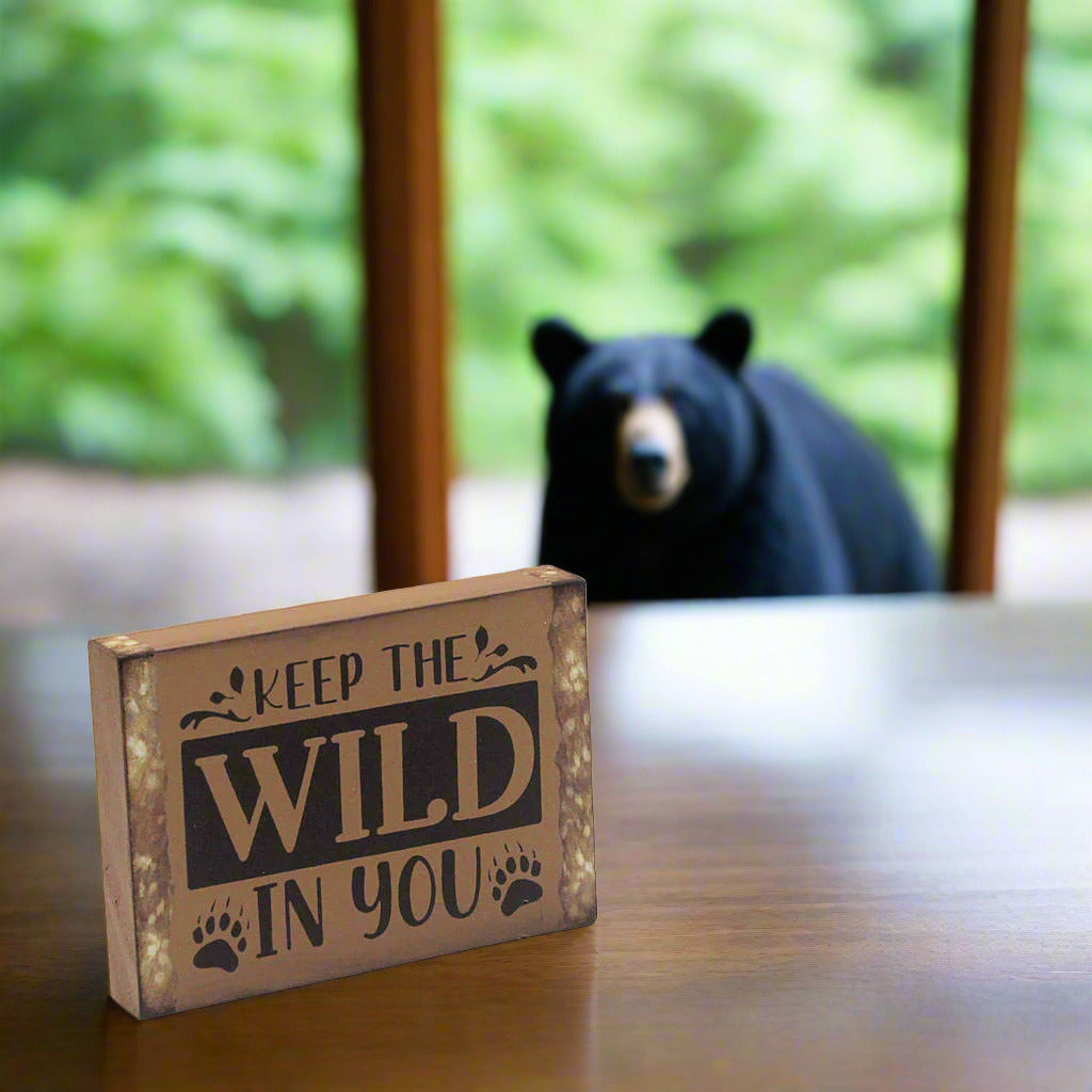 Wooden sign with 'Keep the Wild in You'