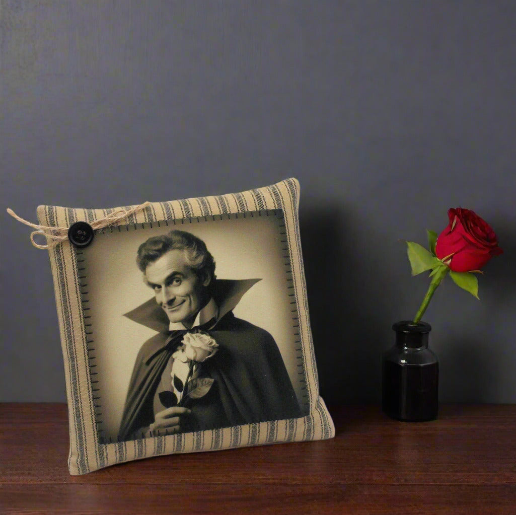 Decorative pillow with a vintage-style portrait of a handsome vampire holding a rose