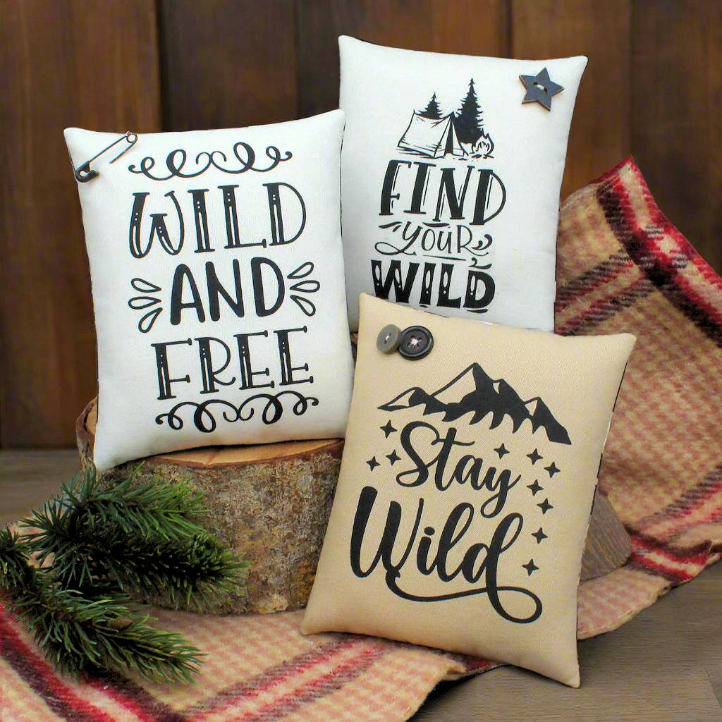 set of three mini pillow signs with quotes about staying and being wild