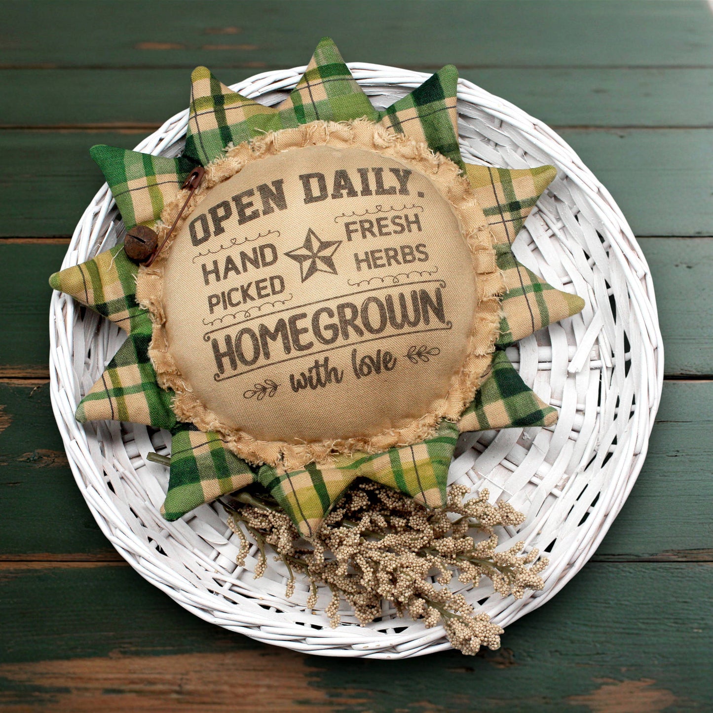 Primitive sunflower ornament with an advertisement for fresh herbs