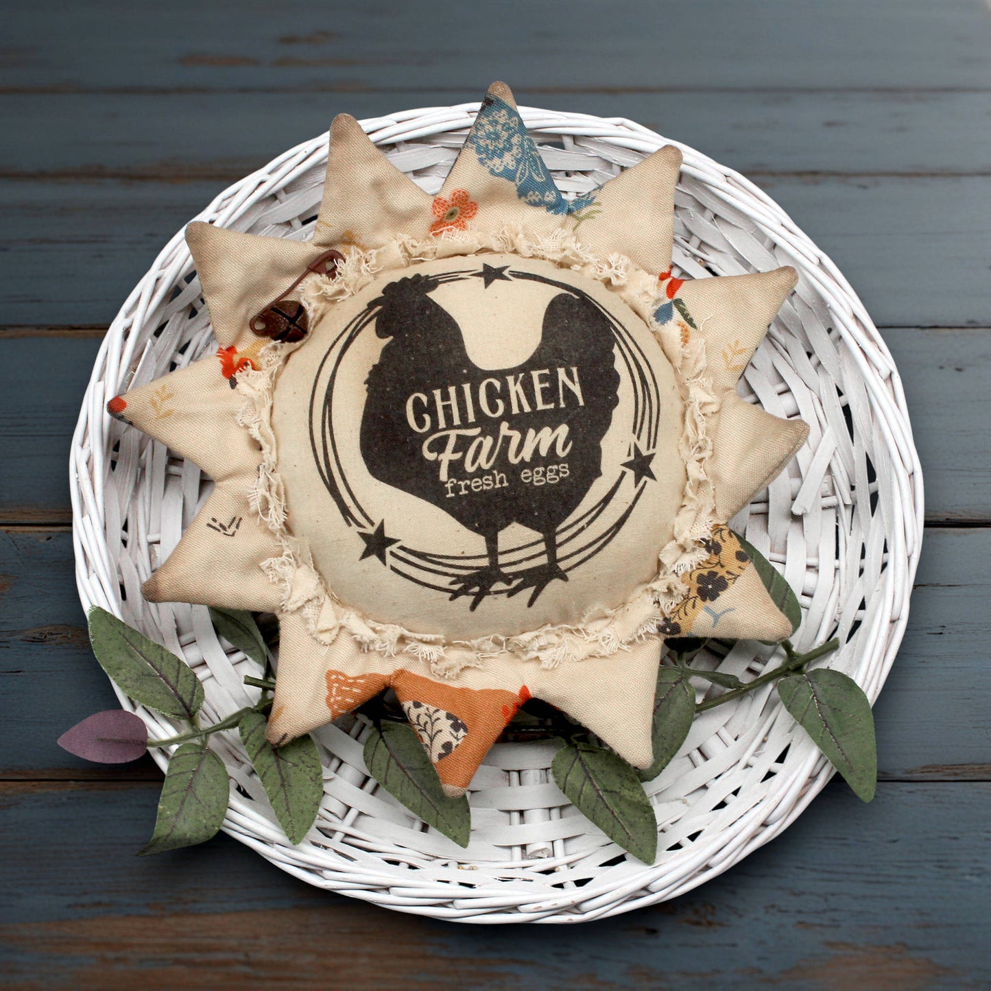 Primitive fabric sunflower ornament with an advertisement for a chicken farm