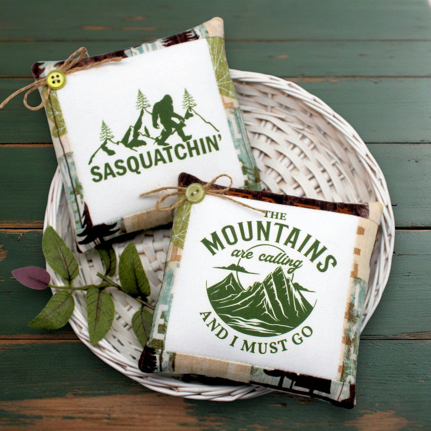 Set of two mini pillow bowl fillers featuring Sasquatch and love for the mountains