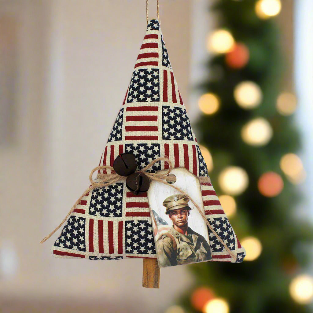 Decorative tree-shaped Christmas ornament with American flag pattern and a tag with a soldier