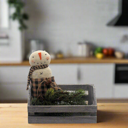 Primitive snowman ornament in a mitten