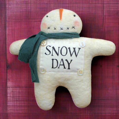 Primitive snowman ornament with a 'snow day' panel on his front