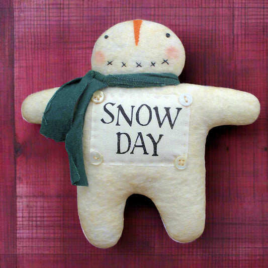 Primitive snowman ornament with a 'snow day' panel on his front