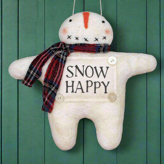 Decorative snowman plush ornament with 'Snow Happy' sign on a green wooden background
