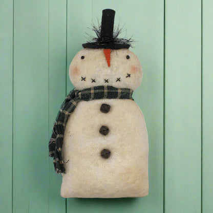 Handmade snowman ornament with a black top hat, carrot nose, and plaid scarf