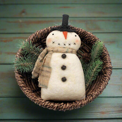Primitive snowman bowl filler in a basket