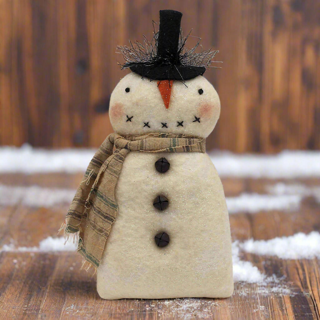 Handmade primitive snowman ornament with a black top hat and rag strip scarf