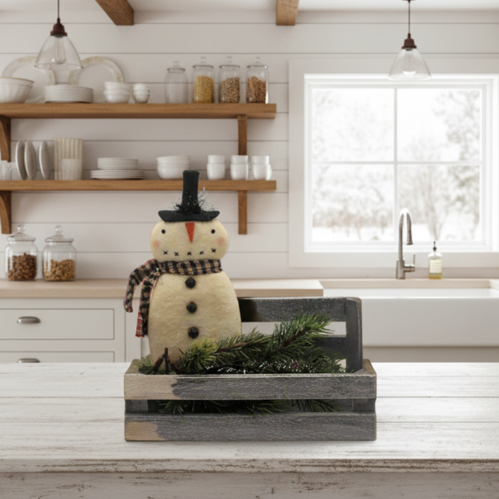 Decorative snowman figure in a kitchen setting with wooden shelves and a window in the background.