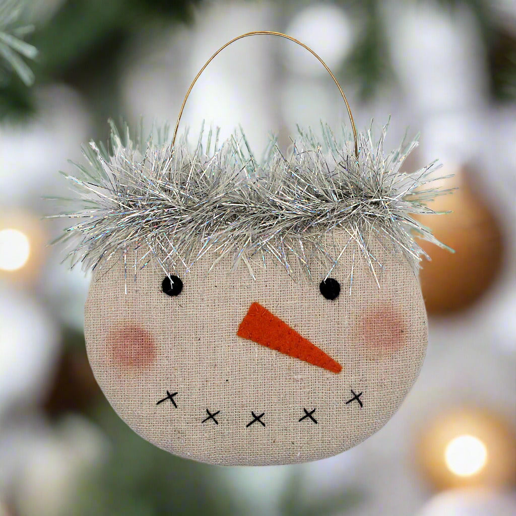 Decorative snowman face ornament with tinsel hair