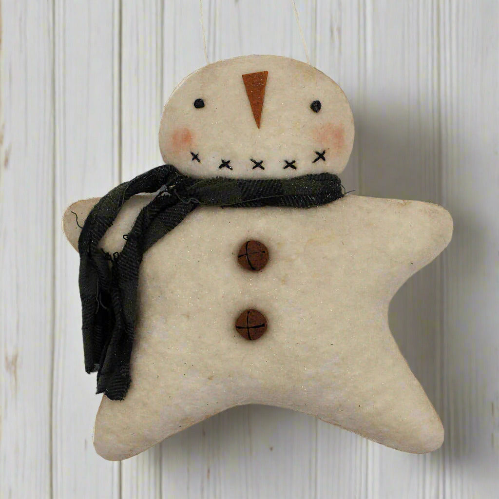 Handmade primitive snowman ornament with a rag scarf on a white background