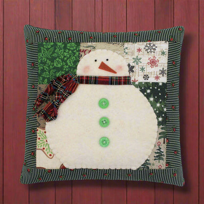 Snowman pillow with a patchwork background