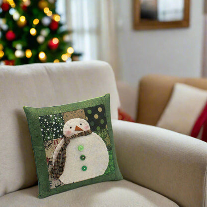 Decorative pillow with a snowman design