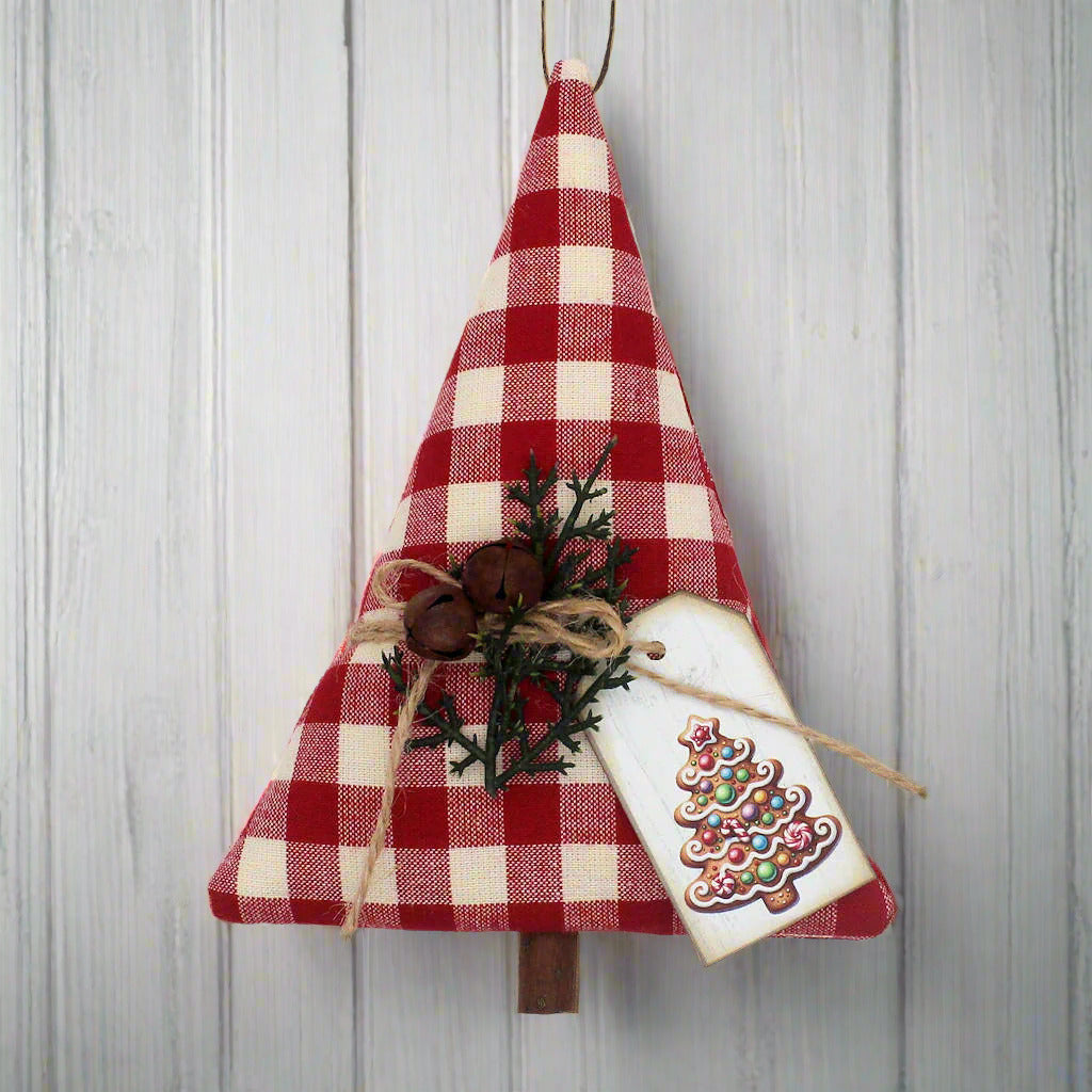Red and white checkered Christmas tree ornament with a tag on a white background