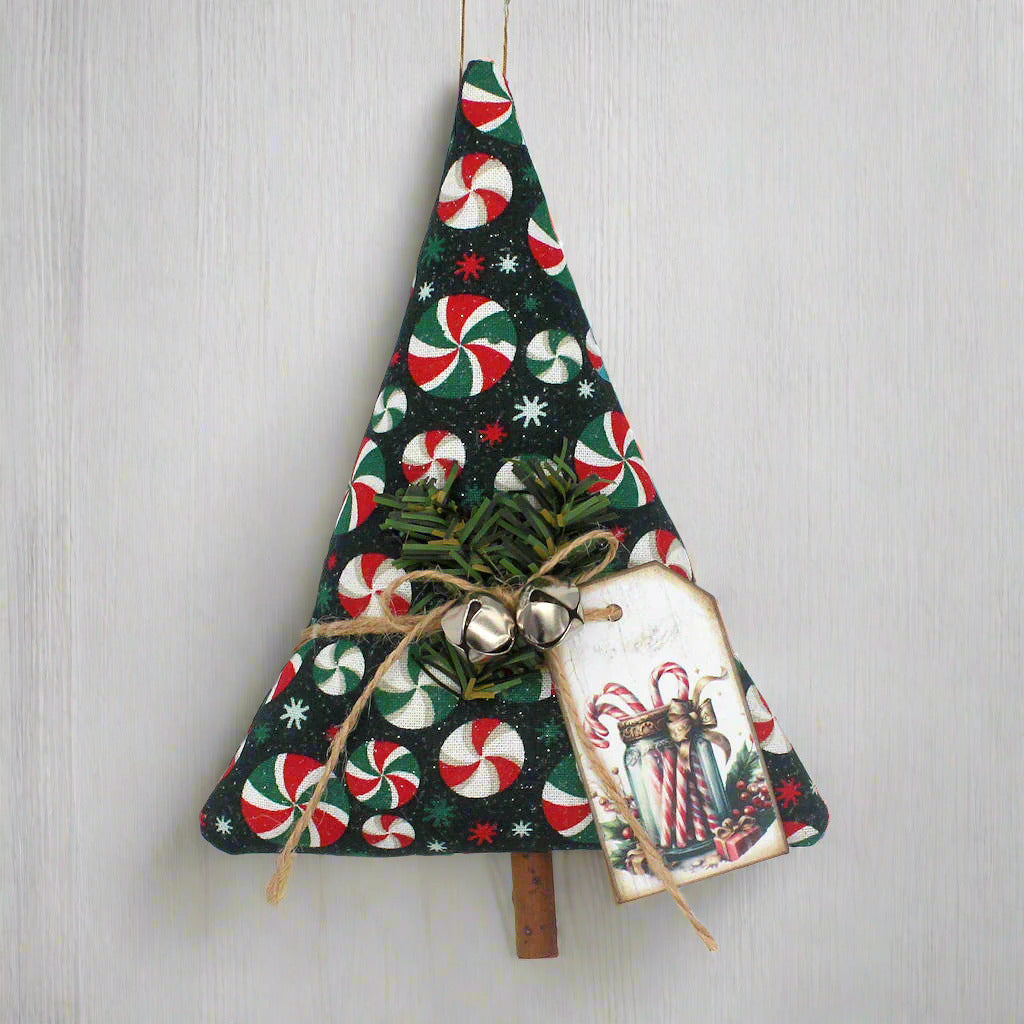 Decorative Christmas tree ornament with candy cane pattern on a white background