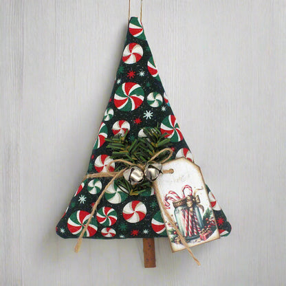 Decorative Christmas tree ornament with candy cane pattern on a white background