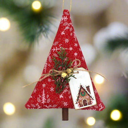 Red fabric Christmas tree ornament with greenery and a tag