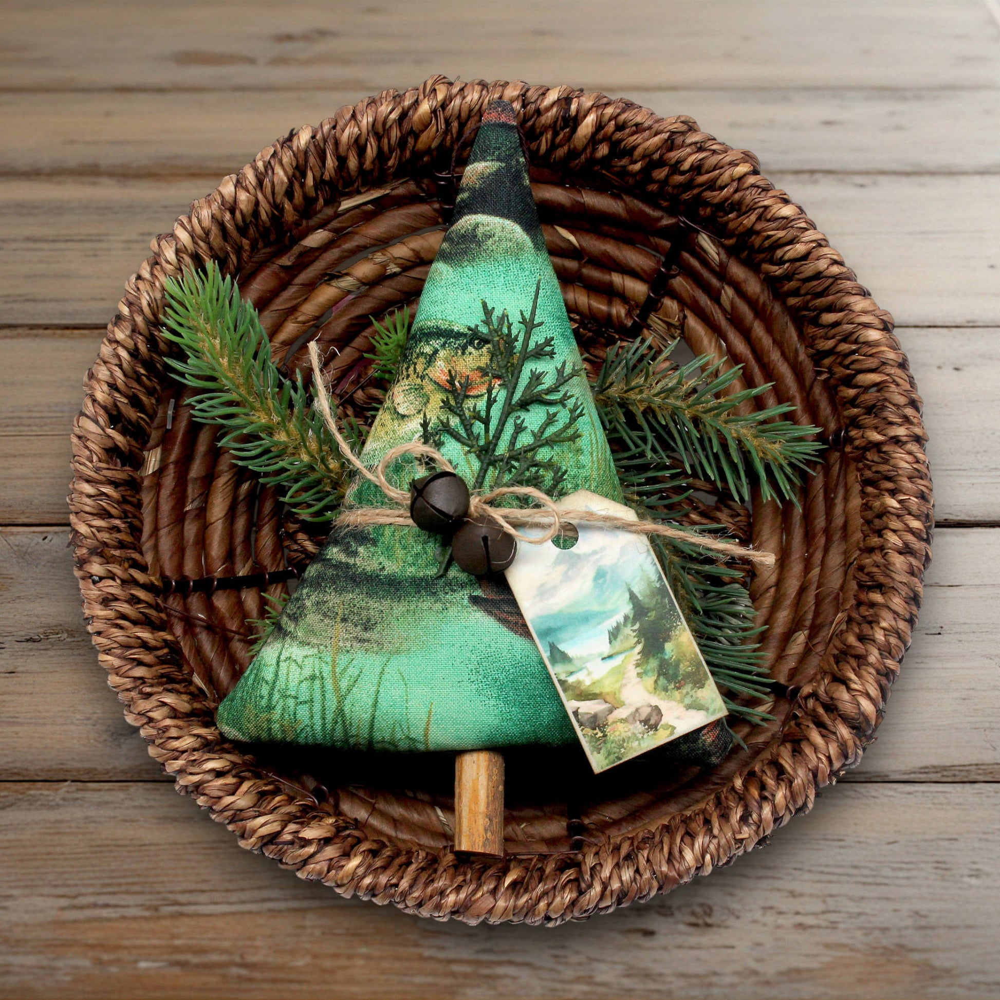 Christmas tree-shaped ornament made from fabric with a nature fishing design