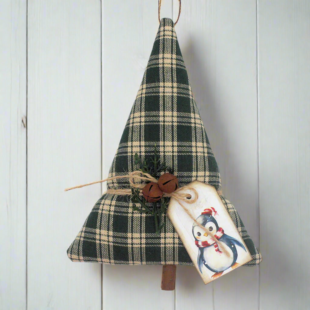 Tree-shaped Christmas ornament or bowl filler sewn from green homespun fabric with bells, greenery and a tag