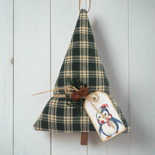Tree-shaped Christmas ornament or bowl filler sewn from green homespun fabric with bells, greenery and a tag