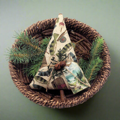 Tree-shaped Christmas ornament or bowl filler with a fishing-themed design along with rusty bells, greenery and a tag