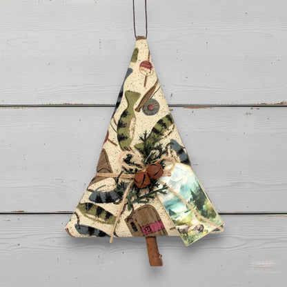 Decorative Christmas tree made of fabric with nature-themed design on a wooden surface