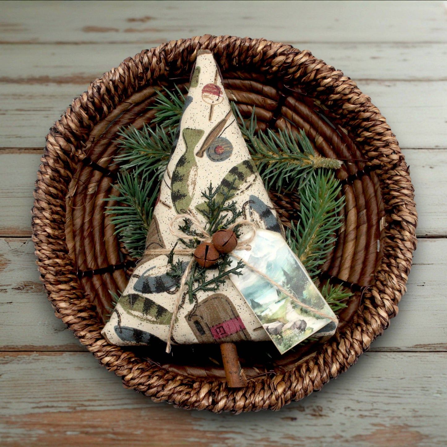 Decorative Christmas tree-shaped fabric ornament with a fishing design