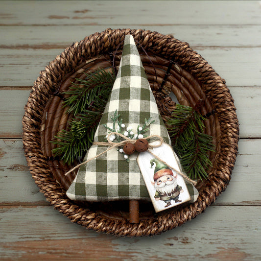 Decorative Christmas tree with plaid pattern on a woven plate with greenery
