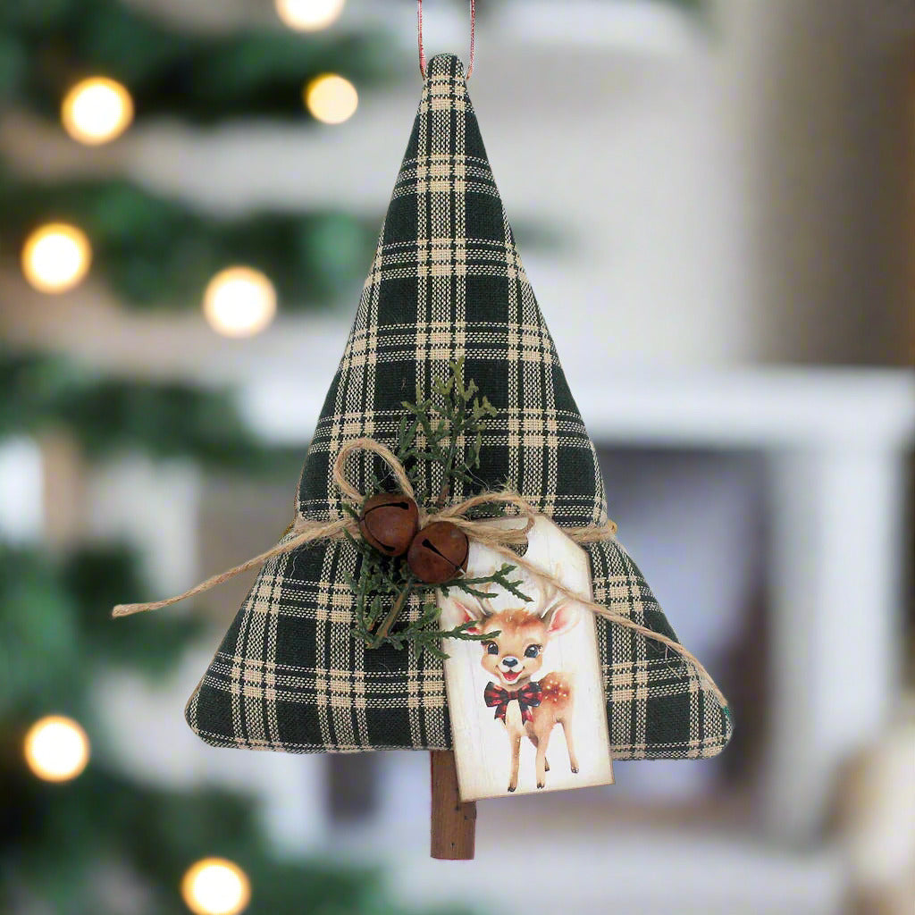 Tree-shaped Christmas ornament or bowl filler from green homespun along with rusty bells, greenery and a tag