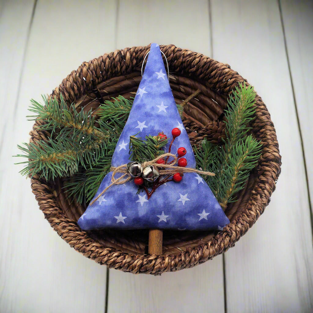 Tree-shaped Christmas ornament or bowl filler with stars on a blue background