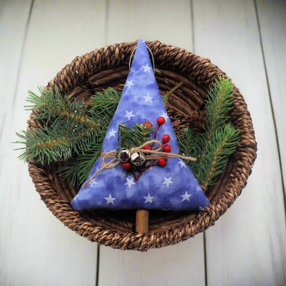 Tree-shaped Christmas ornament or bowl filler with stars on a blue background