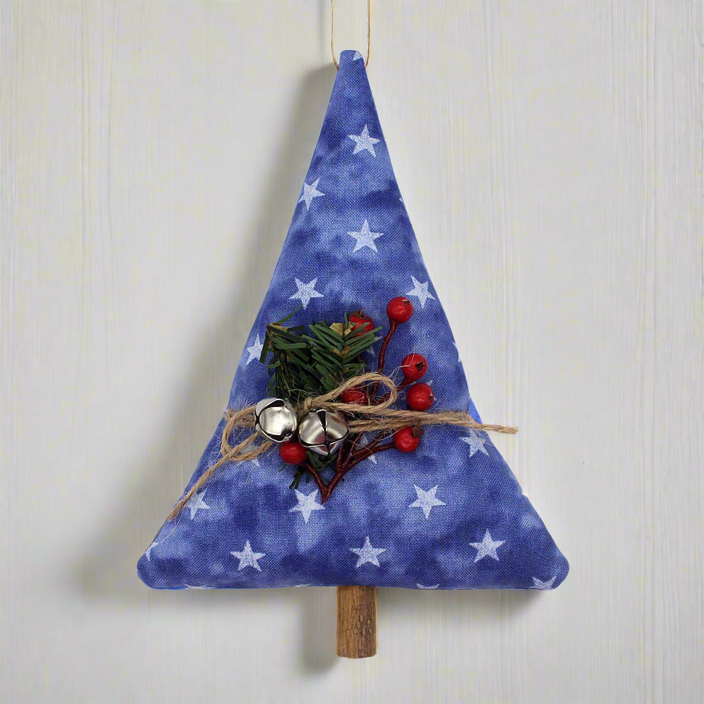 Tree-shaped Christmas ornament or bowl filler with stars on a blue background, bells and greenery