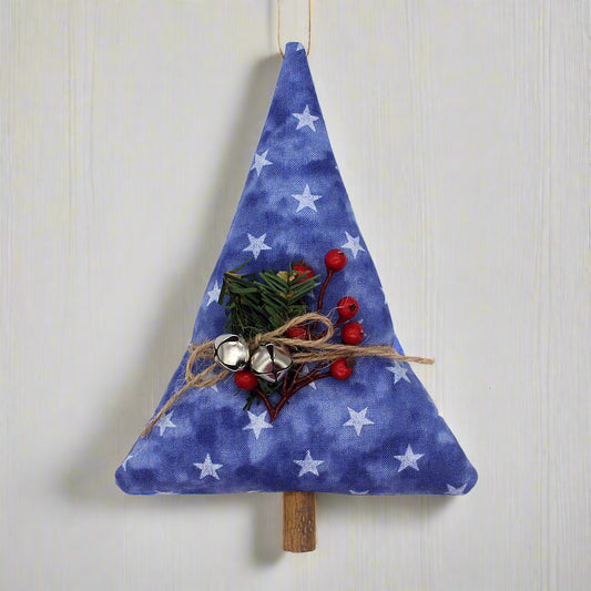 Tree-shaped Christmas ornament or bowl filler with stars on a blue background, bells and greenery