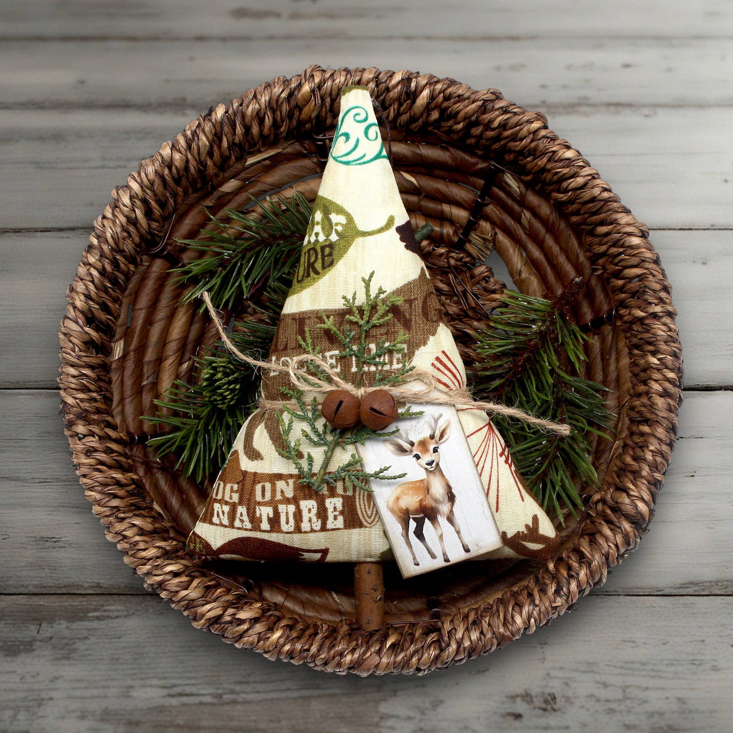 Decorative tree with nature-themed design on a woven plate