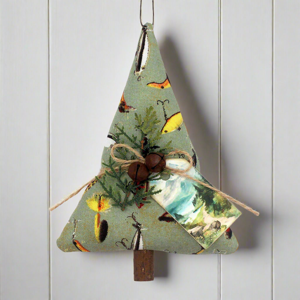 Decorative Christmas tree ornament with nature-themed fabric on a white background