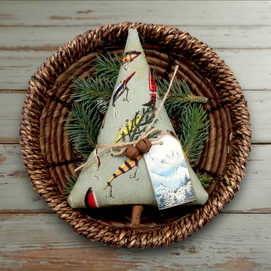 Decorative Christmas tree ornament with nature-themed design on a woven plate